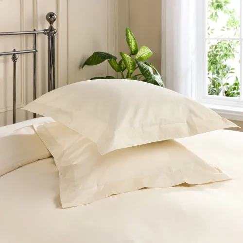 Two pillows with cream coloured Hotel Pure Luxury Oxford pillowcases
