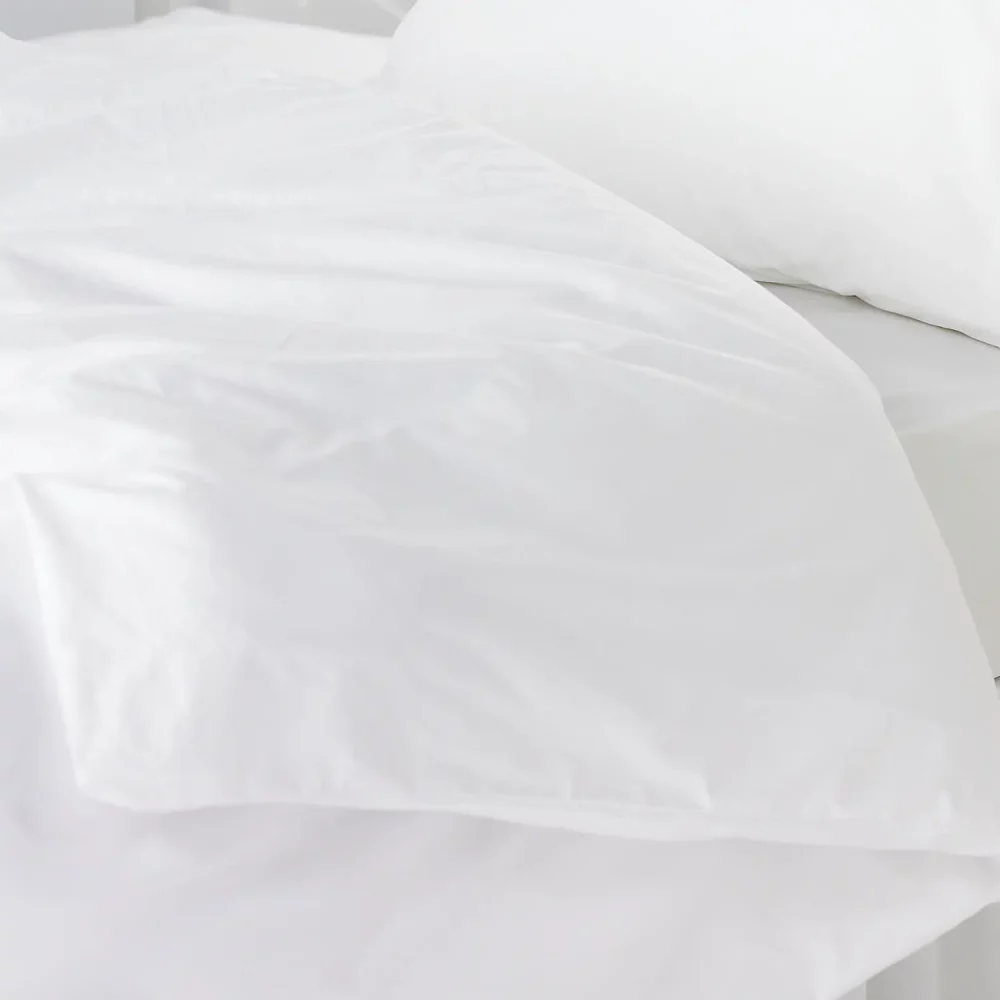 Close up of a white Vision Essentials polycotton plain duvet cover