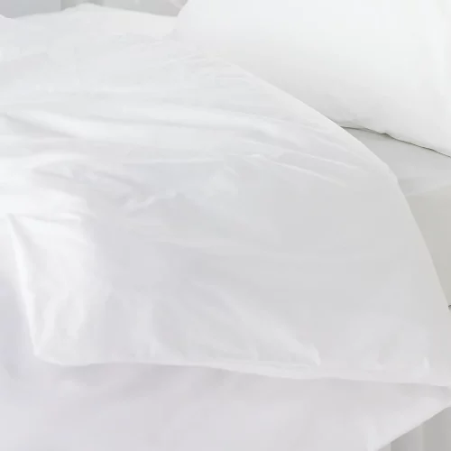 Close up of a white Vision Essentials polycotton plain duvet cover
