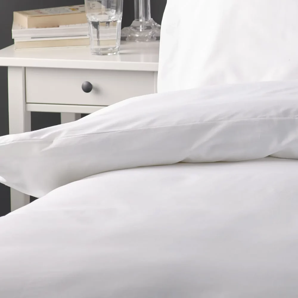 A close up of a cotton rich plain white duvet cover.