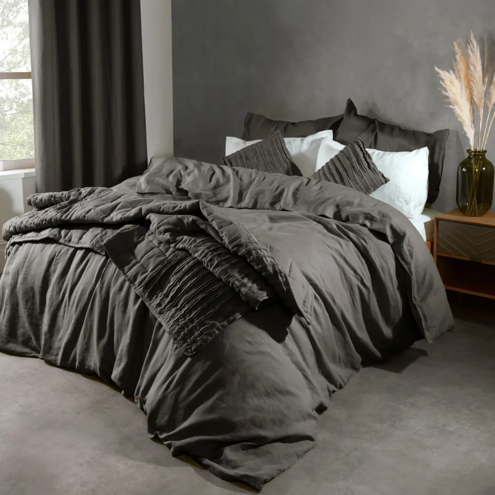 Lazy Linen Charcoal Cushions On Bed
