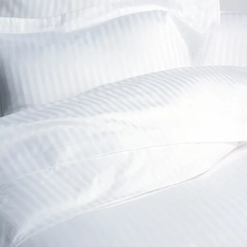 A close up of a satin stripe cotton duvet cover from Liddell