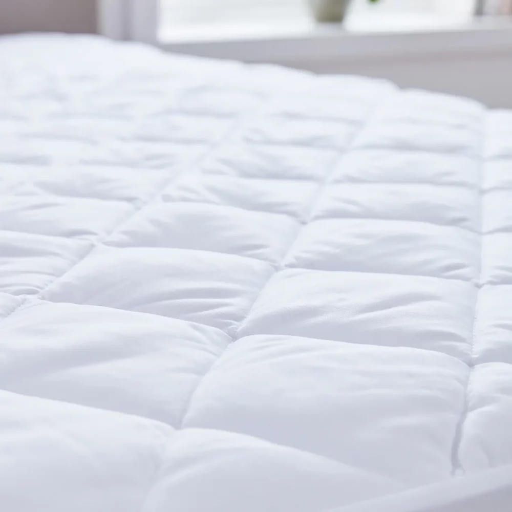 A close up of a super soft ecopure recycled 100% microfibre mattress protector