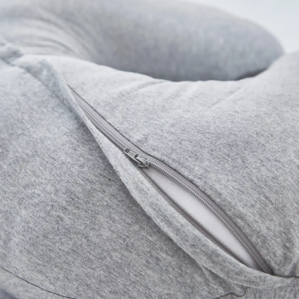 Close up of the zip on a Martex Baby pregnancy and nursing pillow in grey. The zip is slightly open.