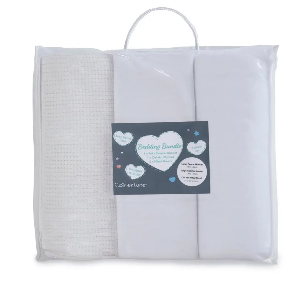 A white cot bed starter set from Clair De Lune in its packaging. It contains a fitted sheet, cellular blanket, and polar fleece blanket.