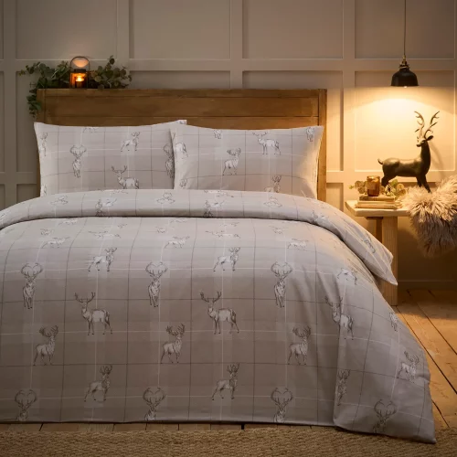 Complete Martex Natural Stag Duvet Cover and Pillowcase Set on a bed