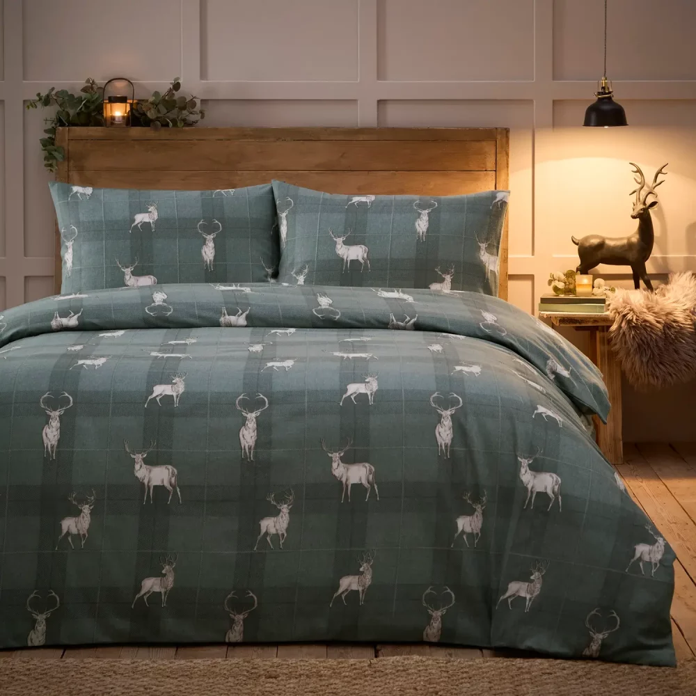 Complete Martex Slate Grey Stag Duvet Cover and Pillowcase Set on a bed
