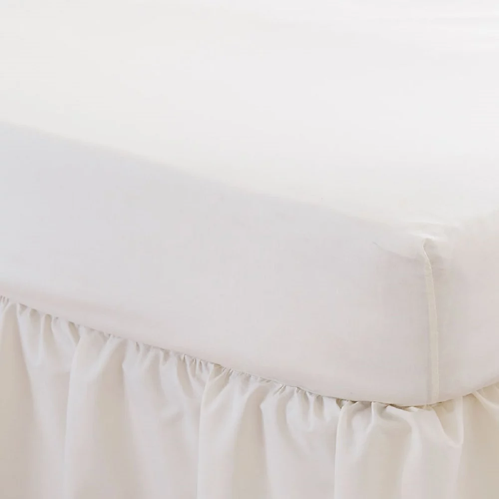 Close up of an ivory Martex Percale Fitted Sheet