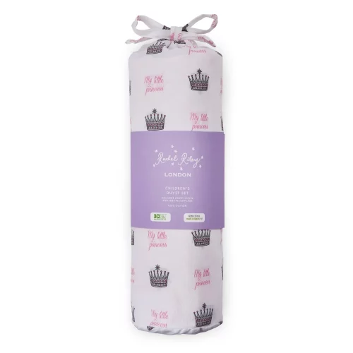 A white duvet cover and pillowcase set from Rachel Riley in its packaging. It comes in a bag which features a print of small crowns all across it with pink writing that says 'My Little Princess'.