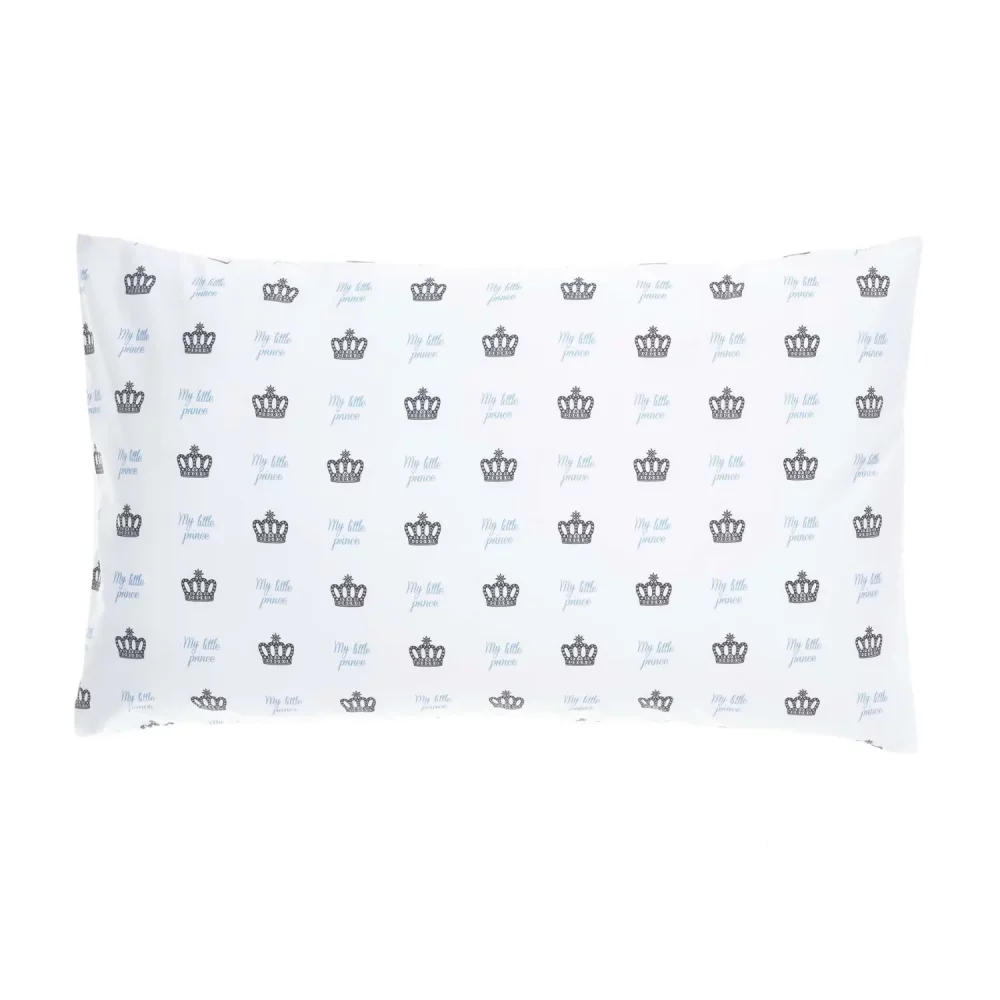 A white pillowcase. It features a print of small crowns all across it with blue writing that says 'My Little Prince'.