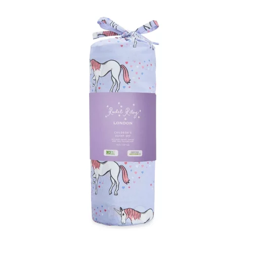 A lilac unicorn patterned duvet cover and pillowcase set from Rachel Riley. It's shown here its packaging bag, which is tied off with a bow.