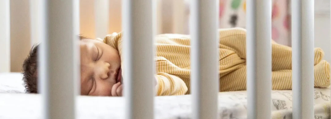 Baby sleeping in crib
